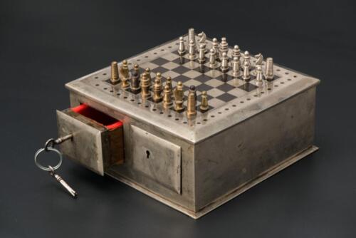 The travel chess set with a metal box-board and magnetic pieces